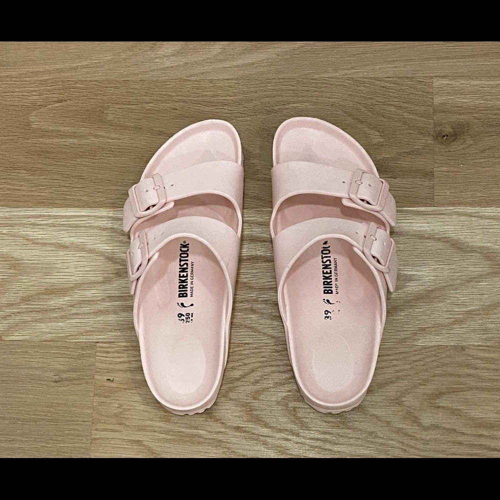 Pink Birkenstock Arizona EVA sandals.